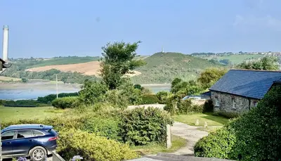 a blue car parked in front of a house at Penheyl, Tregonce near Padstow and Sea in St. Issey