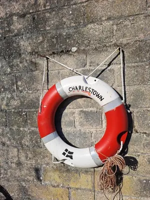 a red and white life buoy sitting on the ground at Bell Tent 2 in St Austell