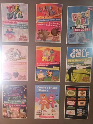 a bunch of posters hanging on a wall at Emma and Simon's hideaway Retreat in Polperro