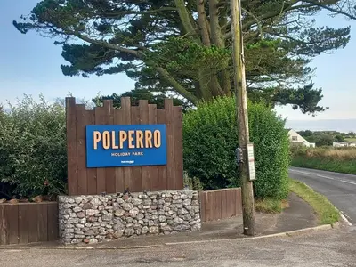 a sign for a peporro sign on a fence at Emma and Simon's hideaway Retreat in Polperro