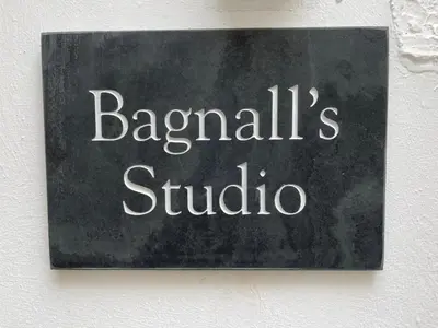 a sign on a wall with the wordsandals studio at Bagnalls Studio, a newly renovated studio in a traditional fisherman's cottage in St Ives
