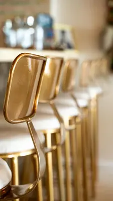 a row of chairs lined up at a counter at The Feather's Hotel Newquay in Newquay