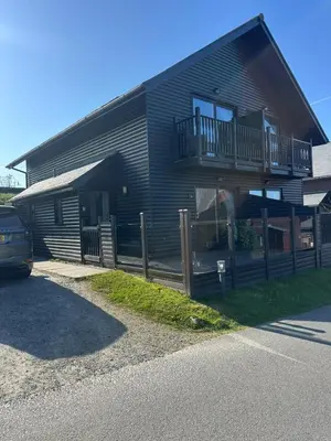 a house with a balcony on the side of it at 5A Retallack Resort & Spa in Saint Columb Major