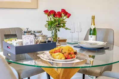 a glass table with a bowl of fruit on it at 1 Bed in Lostwithiel oc-n32748 in Lostwithiel