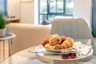 a plate with a teddy bear on a table at 1 Bed in Lostwithiel oc-n32748 in Lostwithiel