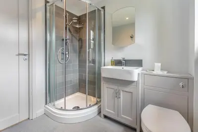 a bathroom with a shower and a sink at 1 Bed in Lostwithiel oc-n32748 in Lostwithiel