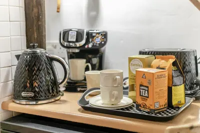 a counter top with a tray of coffee and milk at 2 Bed in Liskeard oc-t32876 in Duloe