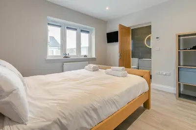 a bedroom with a bed with two towels on it at 4 Bed in Padstow oc-r32776 in Padstow