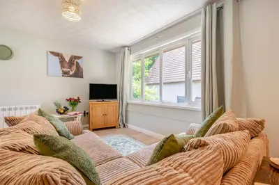 a living room with a couch and a window at 2 Bed in St. Tudy oc-m32233 in Saint Tudy