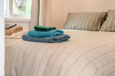 a pile of towels sitting on top of a bed at 2 Bed in St. Tudy oc-m32233 in Saint Tudy