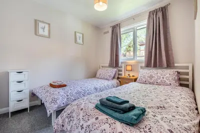 a bedroom with two beds with towels on them at 2 Bed in St. Tudy oc-m32233 in Saint Tudy