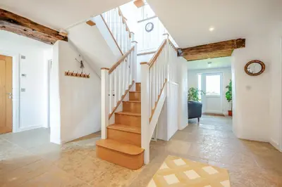 a staircase in a home with white walls and wooden ceilings at 3 Bed in St. Mawgan oc-h30677 in Saint Eval