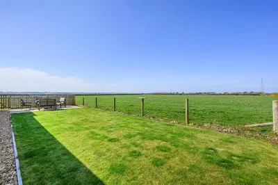 a park with a bench and a grass field at 3 Bed in St. Mawgan oc-h30677 in Saint Eval