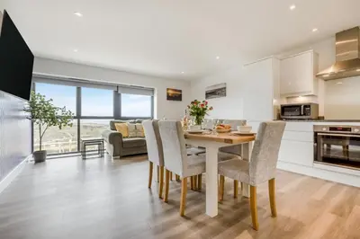 a kitchen and living room with a table and chairs at 3 Bed in Tintagel oc-e32938 in Tintagel