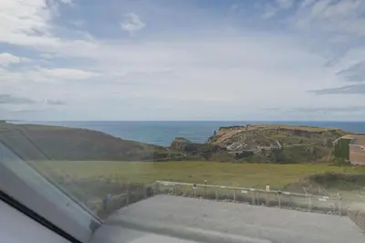 a view of the ocean from a car window at 3 Bed in Tintagel oc-e32938 in Tintagel