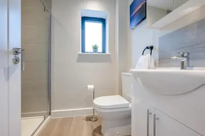 a bathroom with a toilet and a sink and a shower at 2 Bed in Tintagel oc-a32939 in Tintagel