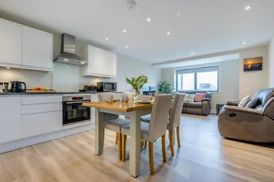 a kitchen and living room with a table and chairs at 2 Bed in Tintagel oc-a32939 in Tintagel