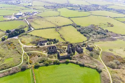an aerial view of a house on a hill at 1 Bed in Four Lanes oc-b32769 in Carnbrea