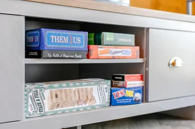 a book shelf with books and other books at 1 Bed in Four Lanes oc-b32769 in Carnbrea