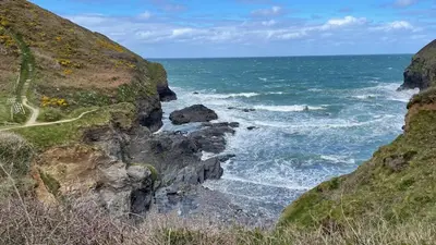 a view of the ocean from a cliff at VARLEY VIEW Fishermans cottage with stunning views in Port Isaac