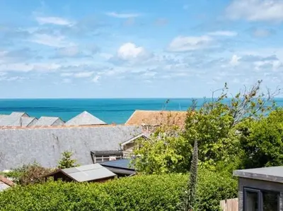 a view of the ocean from the roof of a house at VARLEY VIEW Fishermans cottage with stunning views in Port Isaac
