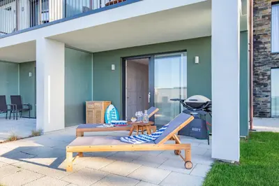 a patio with a bbq grill and a table at 3 Bed in Padstow oc-w28313 in St Merryn
