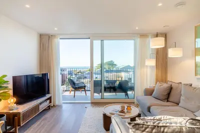 a living room with a couch and a television at 3 Bed in Padstow oc-w28313 in St Merryn