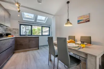 a kitchen and dining room with a table and chairs at 2 Bed in St. Ives oc-e28156 in St Ives