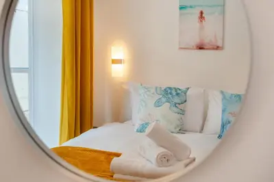 a hotel room with a bed with towels on it at 2 Bed in St. Ives oc-e28156 in St Ives