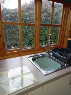a kitchen counter with a sink and a window at The Nook in St Ives