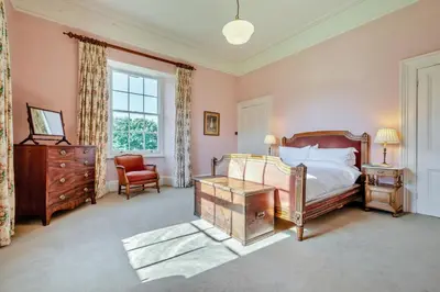 a bedroom with a bed and a desk and a chair at 8 Bed in Tresillian oc-t32986 in Newlyn East