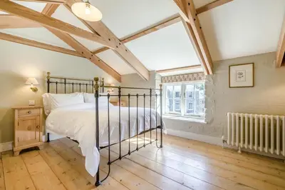 a bedroom with a bed and a window at 6 Bed in Tresillian oc-t32987 in Newlyn East