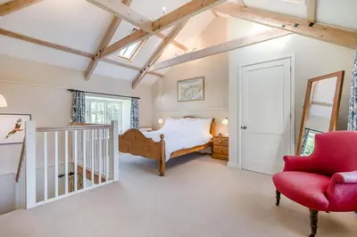 a bedroom with a bed and a chair at 1 Bed in Tresillian oc-t32988 in Newlyn East