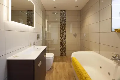 a bathroom with a tub and a toilet and a sink at Callestock Vean in Truro