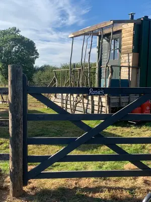 a fence with a swing in a field at Rosies in Liskeard