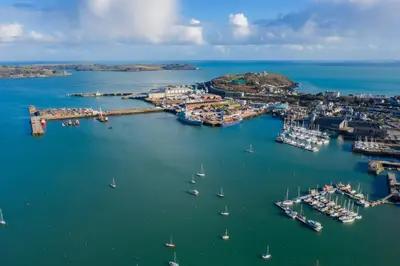 an aerial view of a harbor with boats in the water at Skydeck at The Liner – Stylish 2-Bed / 2-Bath Top Floor with Panoramic Sea Views in Falmouth