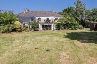 an image of a house with a yard at Temple House in Truro