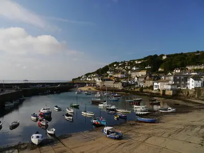 a bunch of boats are docked in a harbor at Jowders Cottage in Marazion