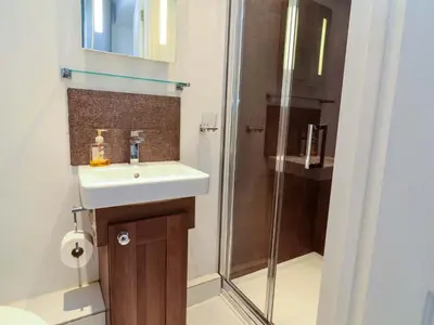 a bathroom with a sink and a shower at Atlantic View Annex in Bude