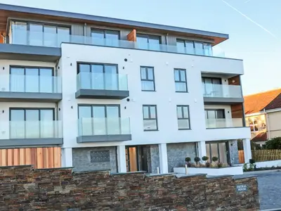 an exterior view of a white building at Beach View Fistral in Newquay