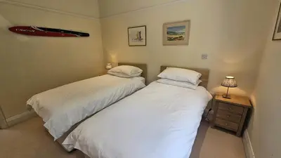 two beds sitting next to each other in a bedroom at Highlands in Saint Mawes