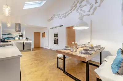 a kitchen and living room with a table in a room at 3 Bed in Carbis Bay oc-p33004 in Carbis Bay