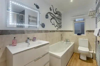 a bathroom with a sink and a tub and a toilet at 3 Bed in Carbis Bay oc-p33004 in Carbis Bay
