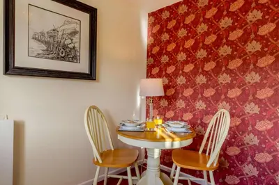 a dining room with a table and four chairs at 1 Bed in Two Waters Foot oc-a27332 in Warleggan