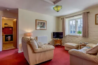 a living room with two couches and a television at 1 Bed in Two Waters Foot oc-a27332 in Warleggan