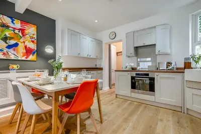 a kitchen and dining room with a table and chairs at 3 Bed in Fowey oc-g33050 in Fowey