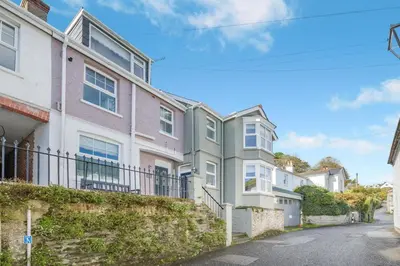 a row of houses on the side of a street at 3 Bed in Fowey oc-g33050 in Fowey