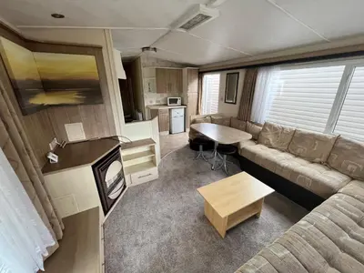 an rv living room with a couch and a table at Riverdale in Saint Clether