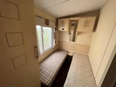 a small room with a bench in a room with a window at Riverdale in Saint Clether