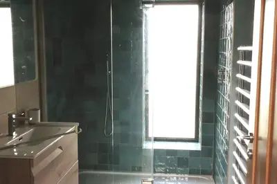 a bathroom with a shower and a sink and a window at Parc an Praze - Cornwall Retreat by the Sea in Perranuthnoe